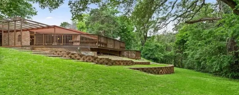 Discover the allure of mid-century modern living in this Waco, Texas home set on a sprawling .75-acre lot.